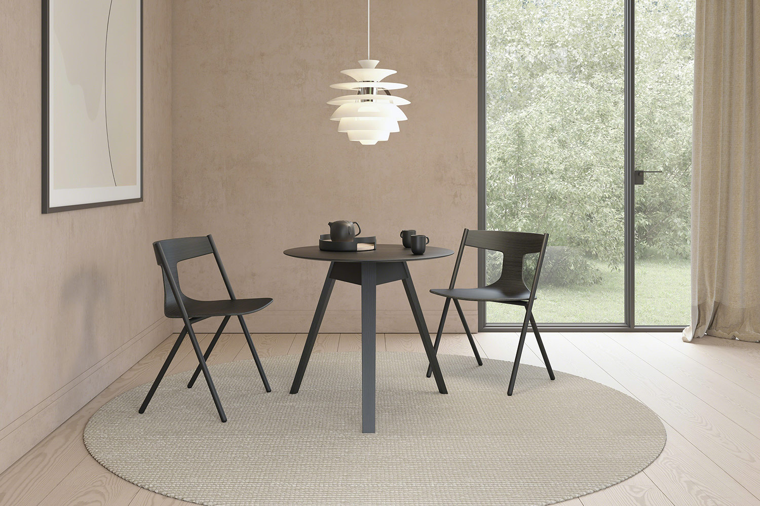 black Trivio table with two chairs on a carpet under a light
