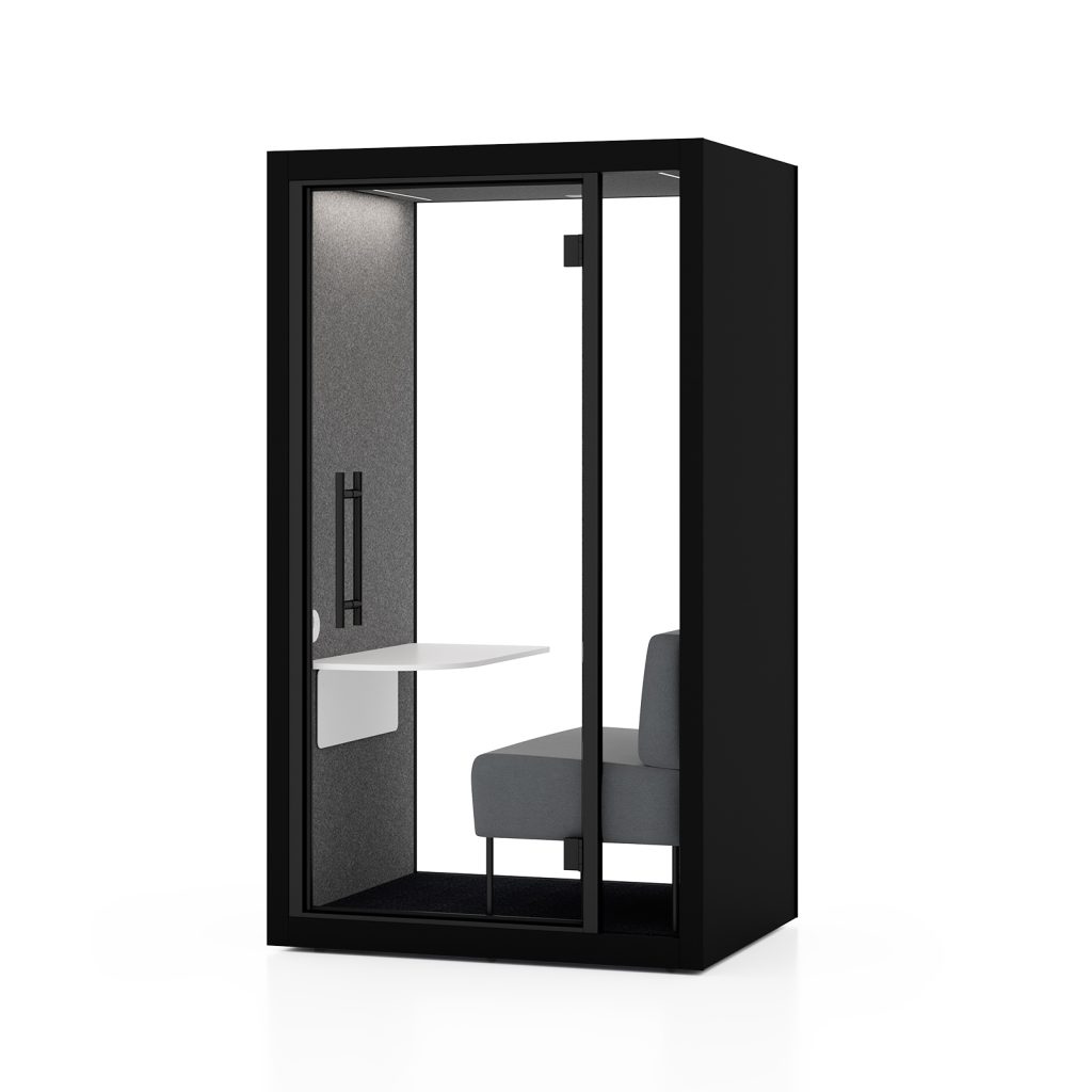 Silen Chatbox solo booth in black with a grey sofa and a white table