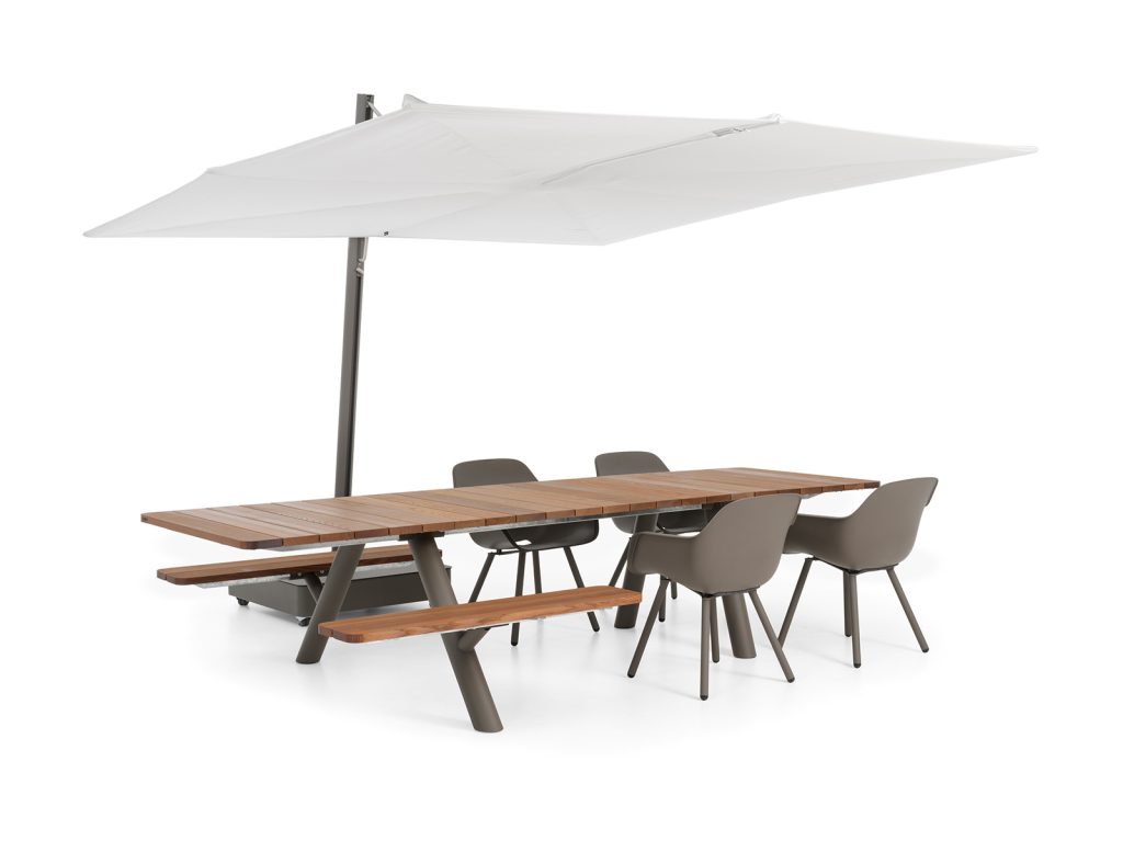 Extremis Panigiri combo table with benches and chairs and a white parasol