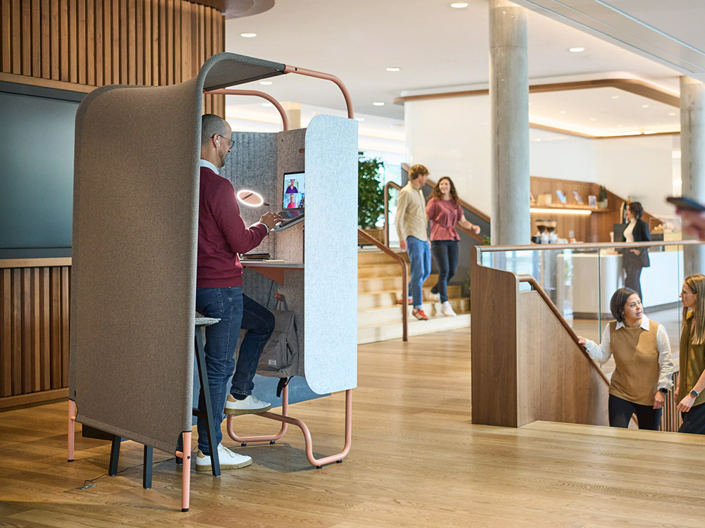 flex kiosk in a busy open space area opposite two staircases