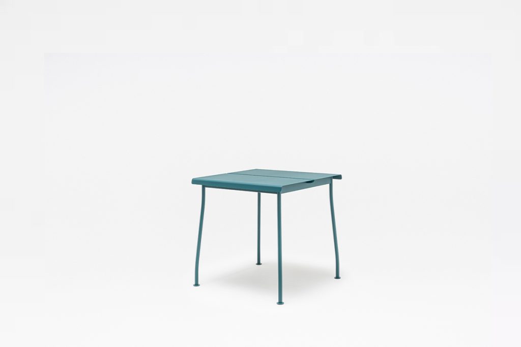 Turquoise flaner cafe table in grey background